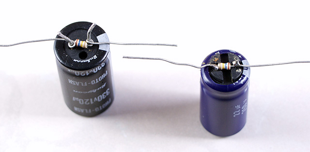 Capacitors with resistors